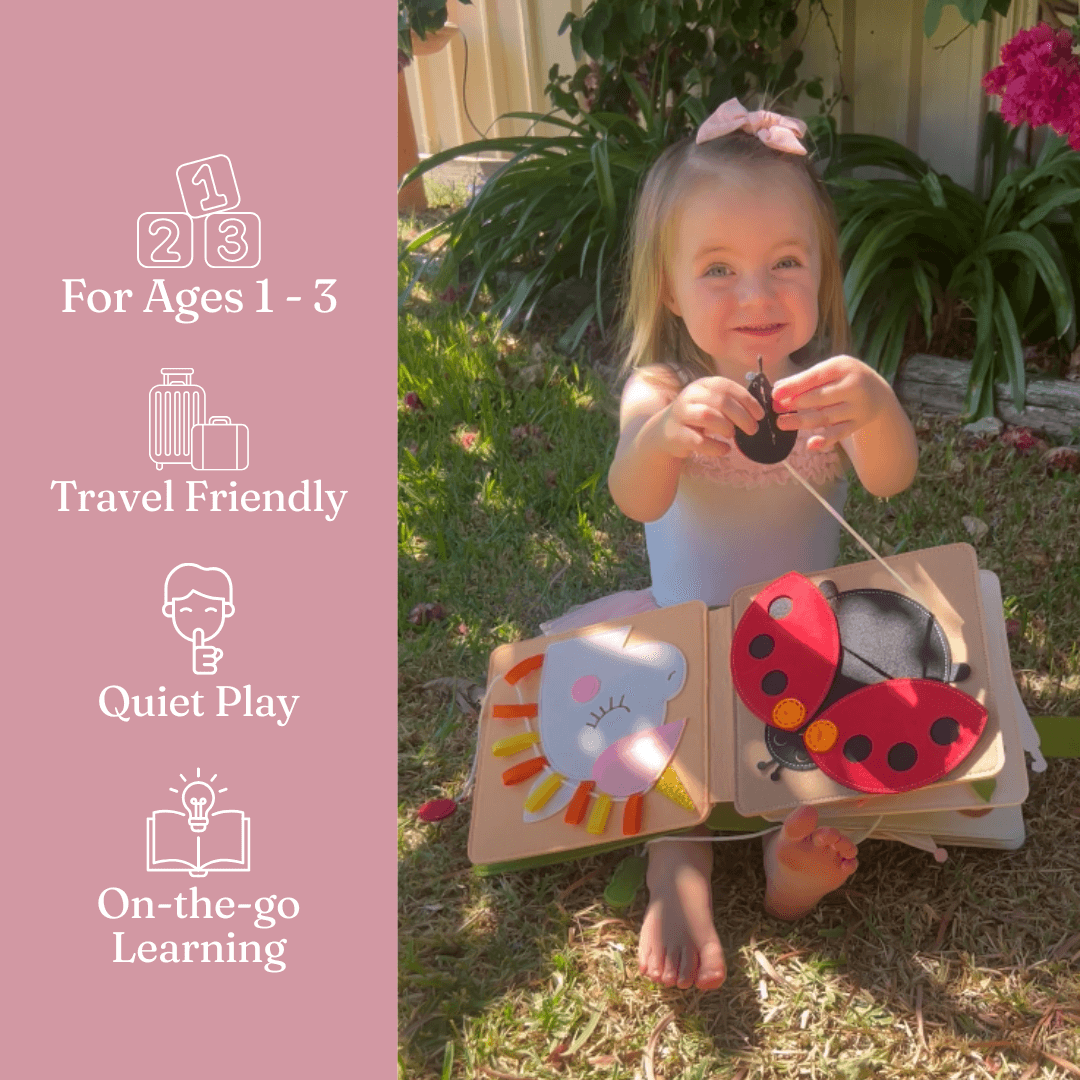 Toddler playing with Berry Lane personalised felt busy book by Cubby
