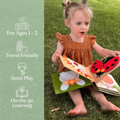 Toddler playing with Magic Meadow personalised felt busy book by Cubby