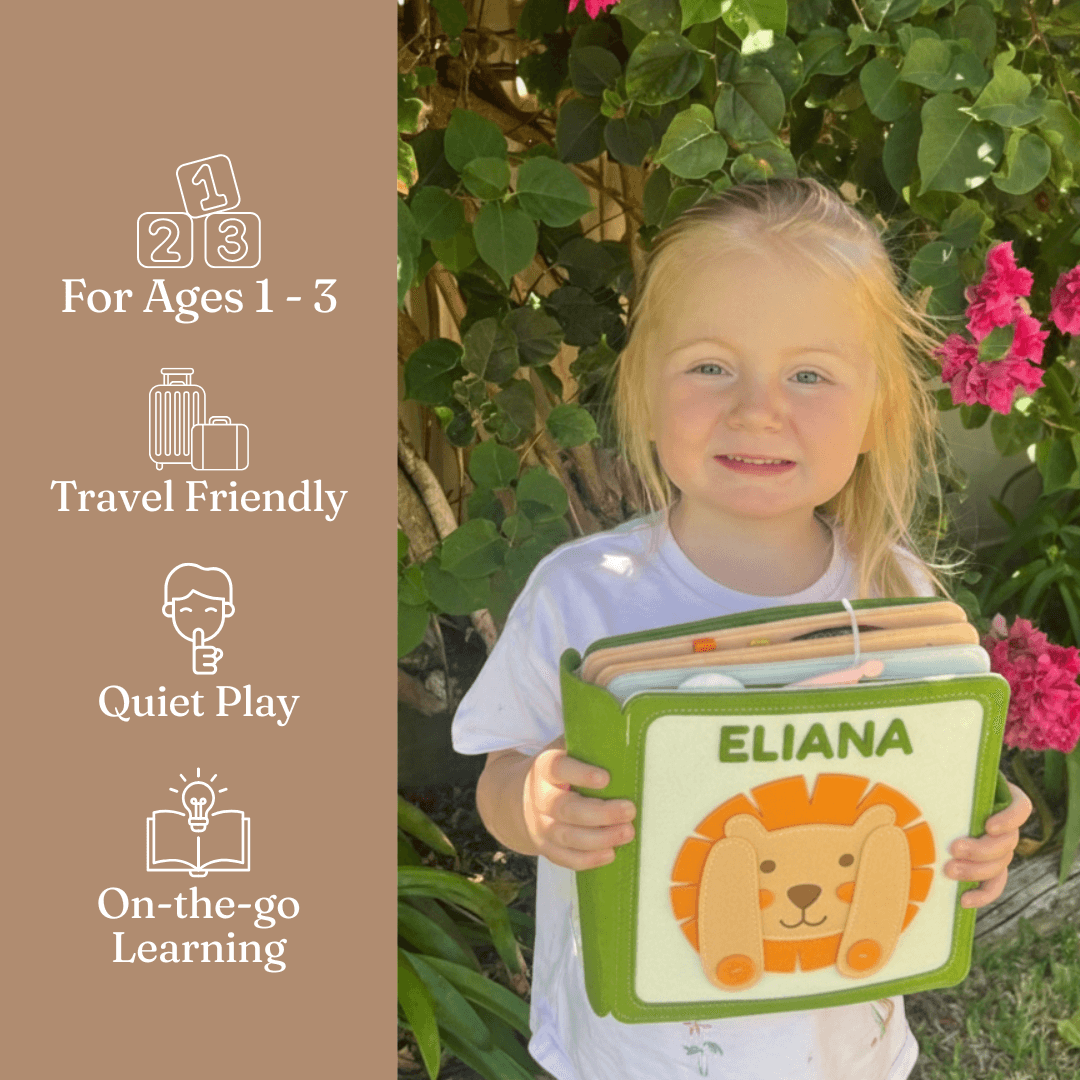 Toddler playing with Secret Safari personalised felt busy book by Cubby